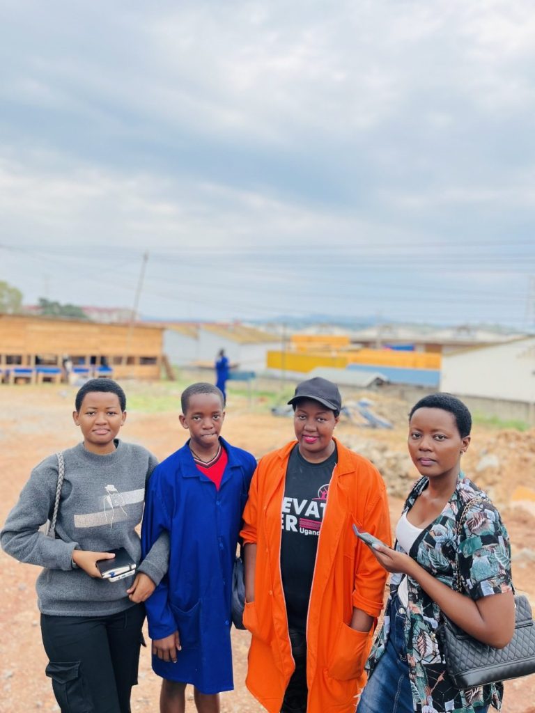 Women in overalls at the Nkombe dairy farm