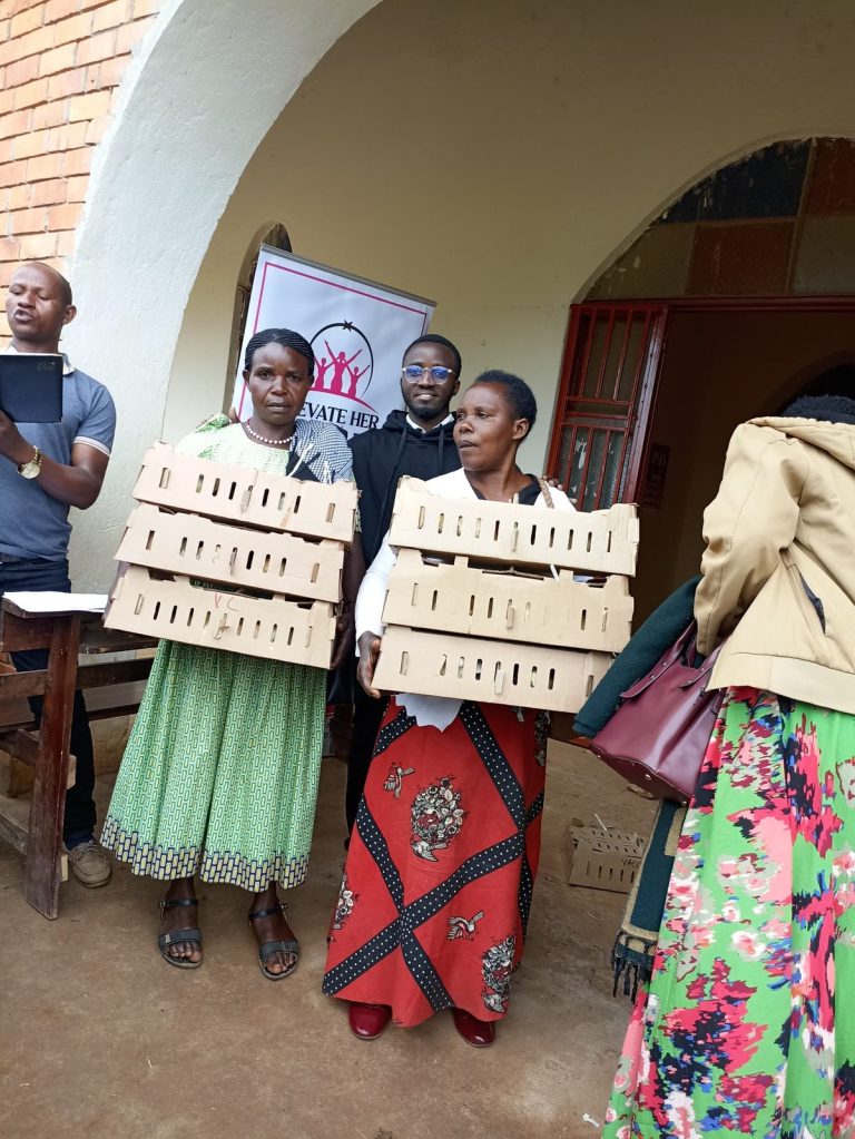 Women with boxes of chicks